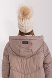 Cozy winter beanie with turn-up, plaid weave, and pom-pom.