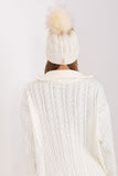 Cozy winter beanie with turn-up, plaid weave, and pom-pom.