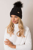Cozy winter beanie with plaid weave and playful pom-pom.