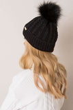 Cozy winter beanie with plaid weave and playful pom-pom.