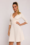 Elegant Flared Knit Mini Dress with Unique Polish Charm