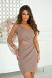 Asymmetrical mini dress with stunning sequin sleeves.