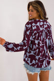 Eco-Friendly V-Neck Blouse with Unique Print and Puffy Sleeves