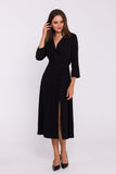 Elegant High-Slit Dress with Flared Hem and Button Detail