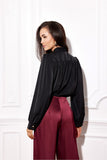 Elegant Blouse with Puffy Sleeves and Decorative Tie Neckline