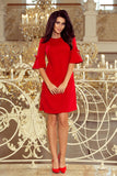 Feminine Red Trapeze Dress with Flared Sleeves and Bows