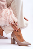 Elegant Pointed Toe Leather Pumps with Unique Heel Detail