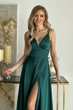 Elegant satin dress with cut-out top and flowing slit skirt.