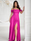 Elegant Fitted Dress with Flowing Skirt and Slit Detail